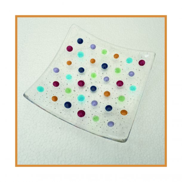 Clear dish with coloured spots