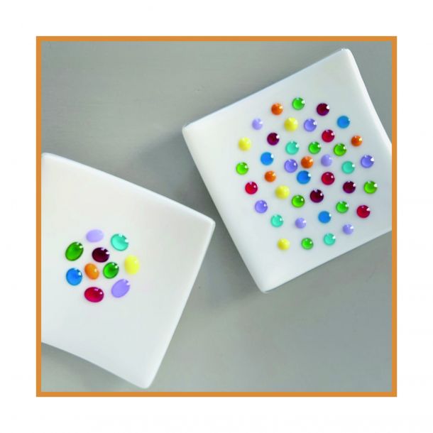 White dishes with coloured spots